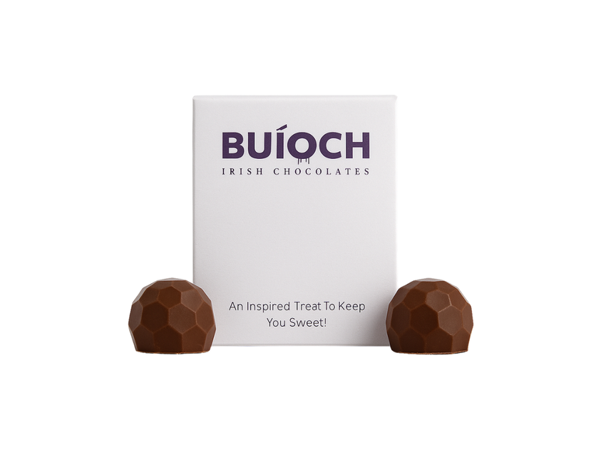 Buíoch mini chocolate pouch beside two milk chocolates