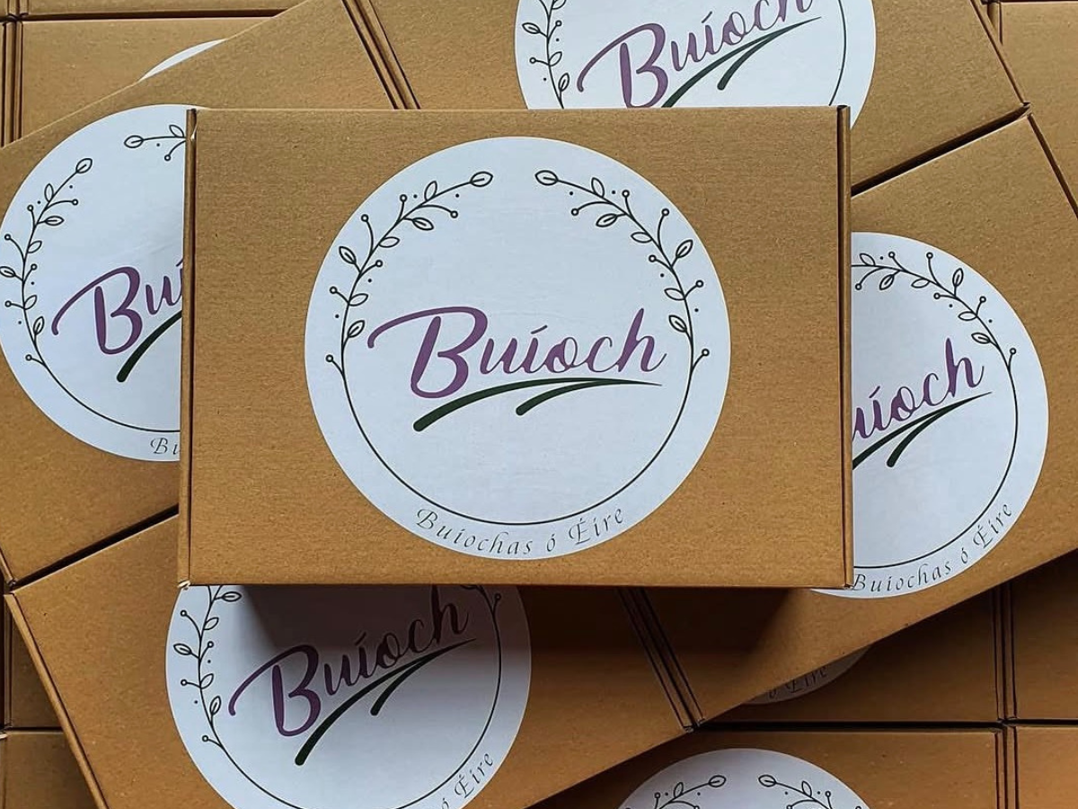 Brown Buíoch gift boxes with the original round logo labels