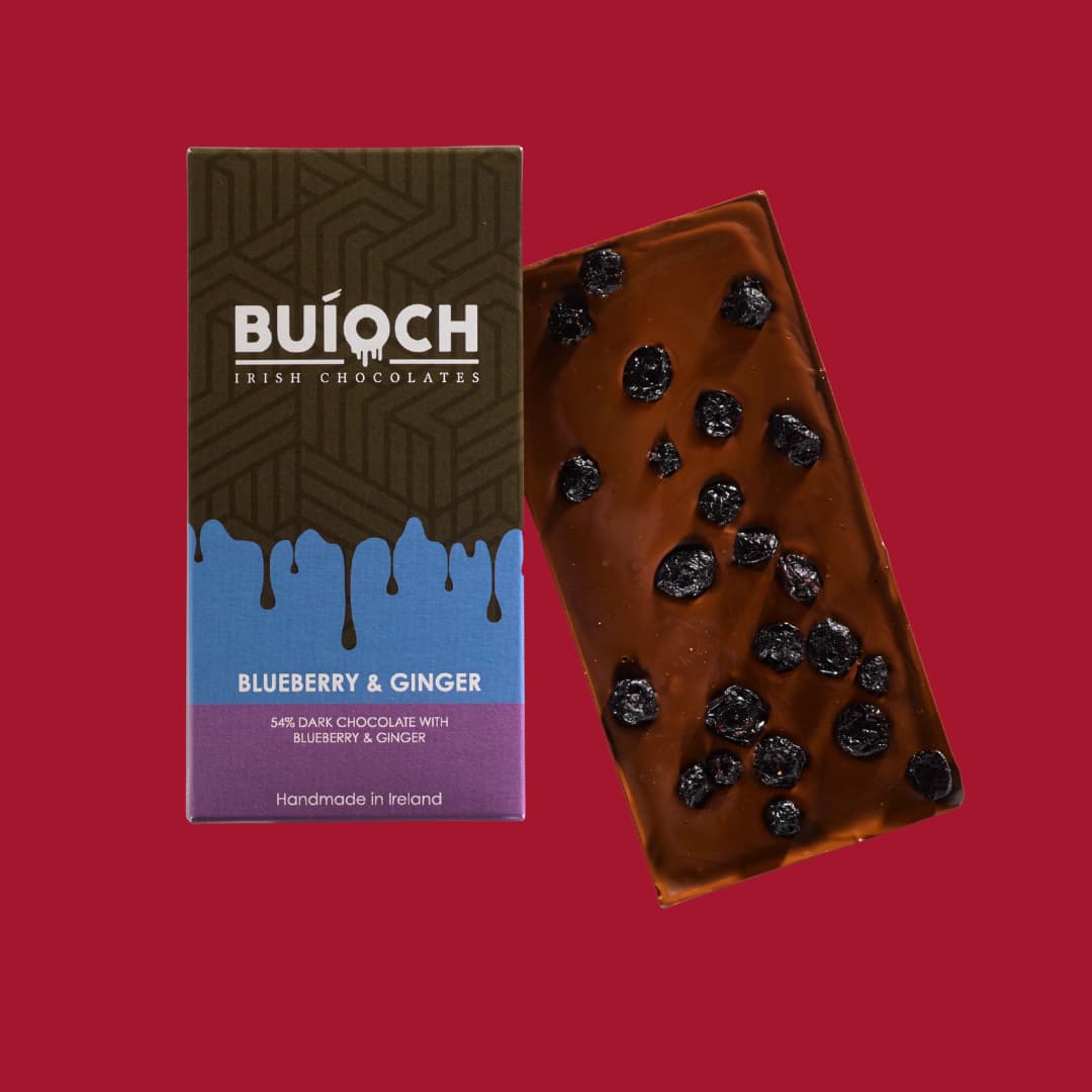 Blueberry and Ginger Bar - Dark chocolate. Handmade by Buíoch Irish Chocolates. Packaging and bar on a crimson background.