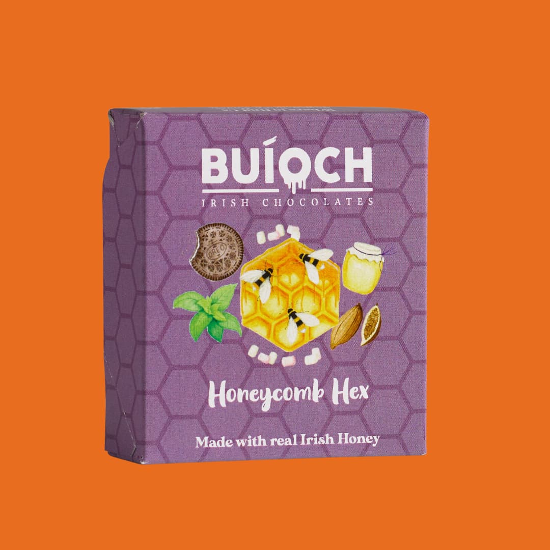 Dark Chocolate Mint Honeycomb Hex - Packaging on an orange background. Handmade by Buíoch Irish Chocolates.