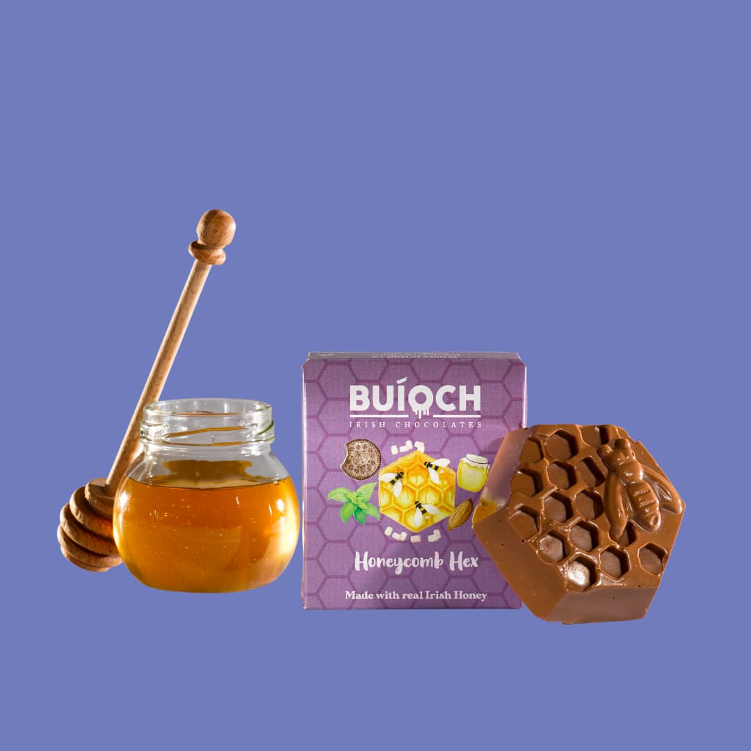 Milk Chocolate Honeycomb Hex - Packaging on an blue background. Handmade by Buíoch Irish Chocolates.