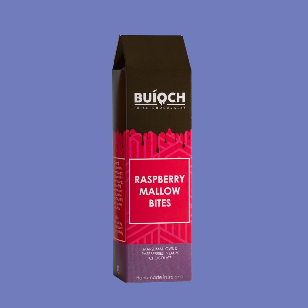 Raspberry Mallow Bites - Marshmallow and Raspberries in Dark Chocolate. Handmade by Buíoch Irish Chocolates. Packaging on a Blue Background.