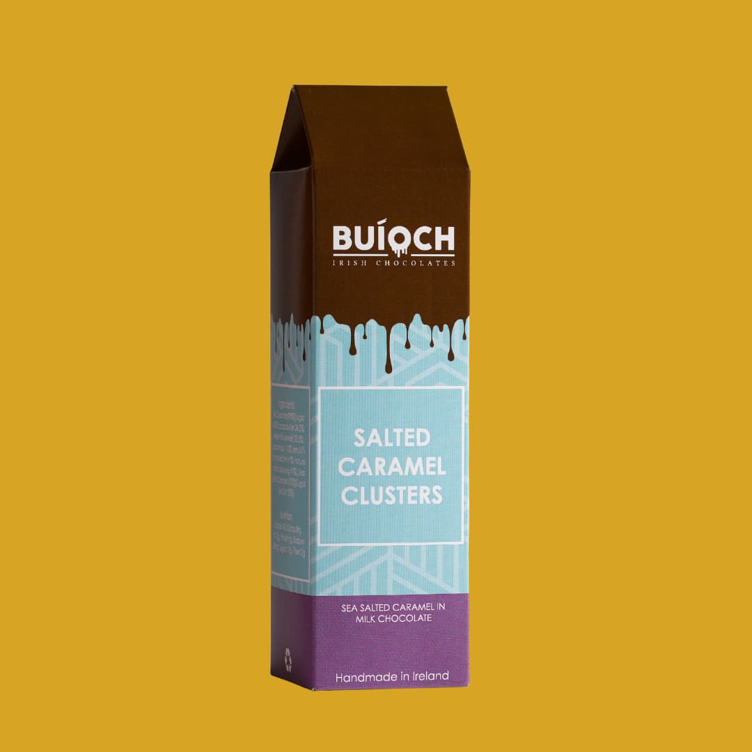 Salted Caramel Clusters - Sea salted caramel in milk chocolate. Handamde by Buíoch Irish Chocolates. Packaging on a gold background