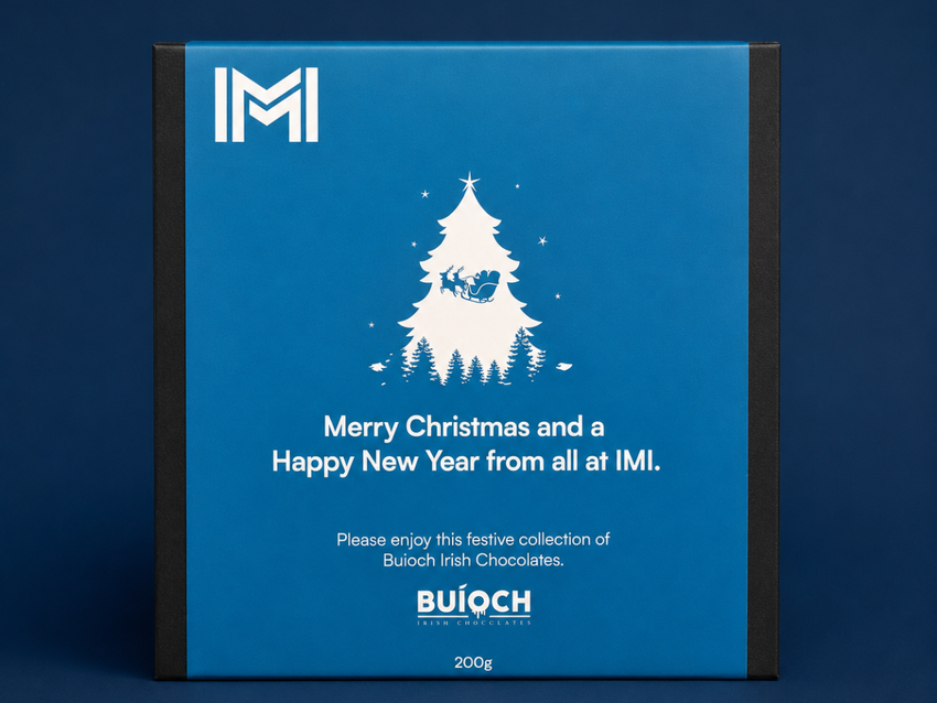 Blue IMI-branded Christmas chocolate gift packaging