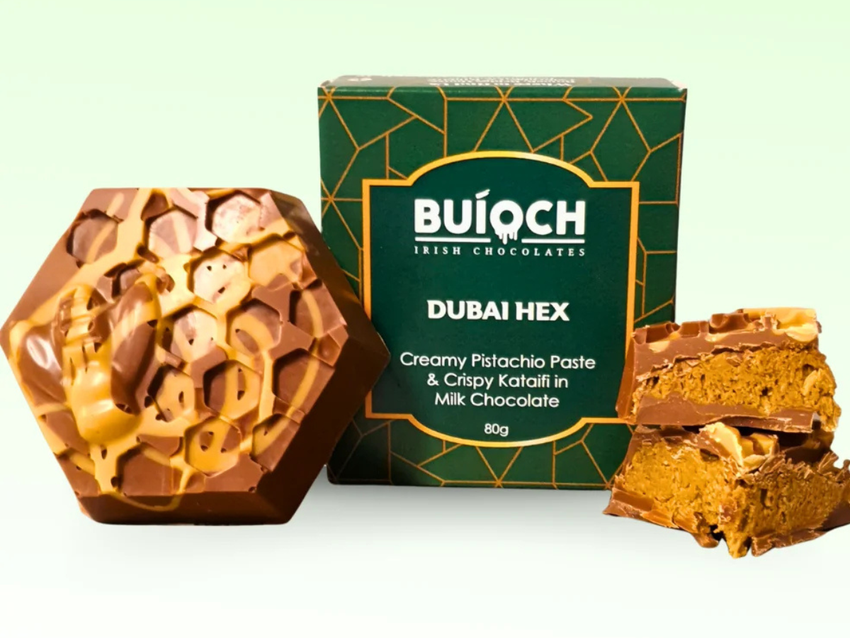 Buíoch Dubai Hex with branded packaging and cut pieces showing the pistachio filling