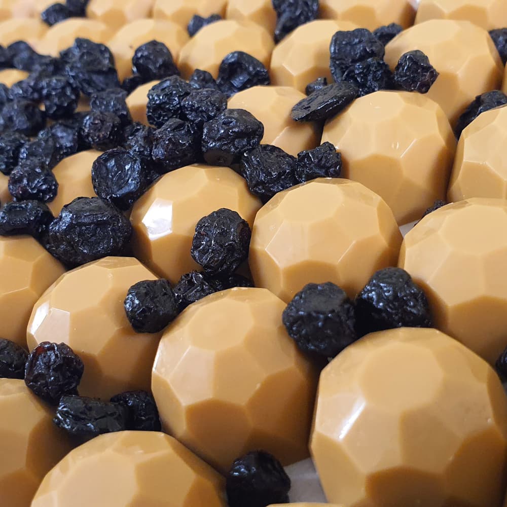 Caramel chocolate and blueberries, June 2022 Inspired chocolate creation, handmade by Buíoch Irish Chocolates