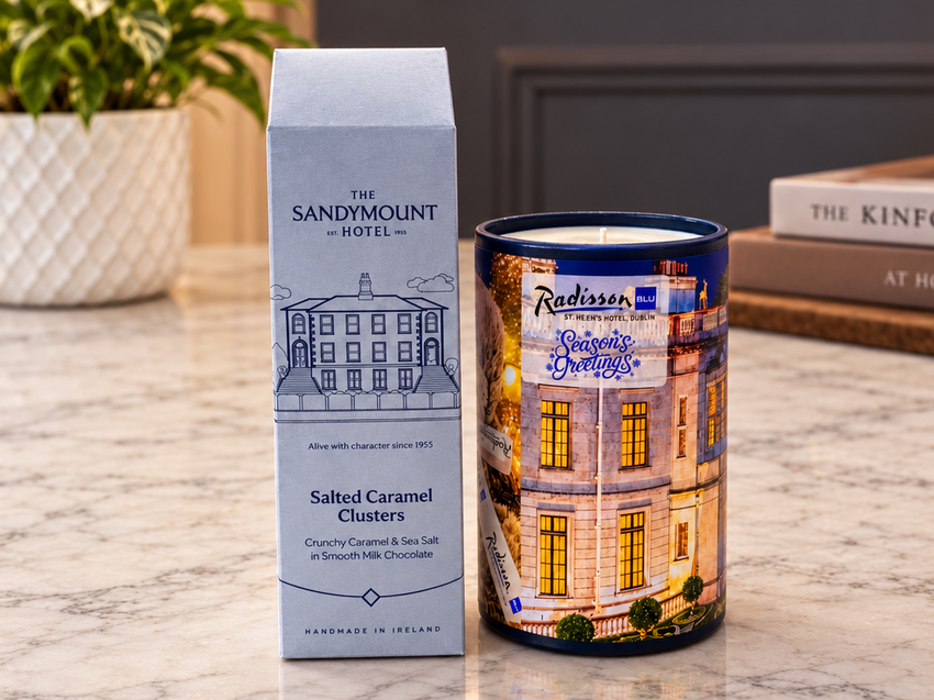 Sandymount Hotel chocolate carton and Radisson Blu festive gift tin on a marble table