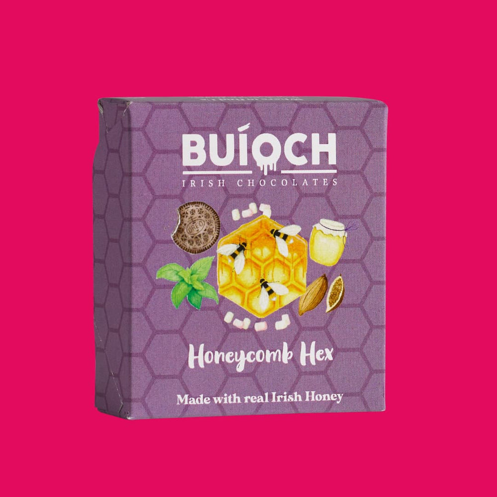 
                  
                    Dark Chocolate Orange Honeycomb Hex - Packaging on a pink background. Handmade by Buíoch Irish Chocolates.
                  
                