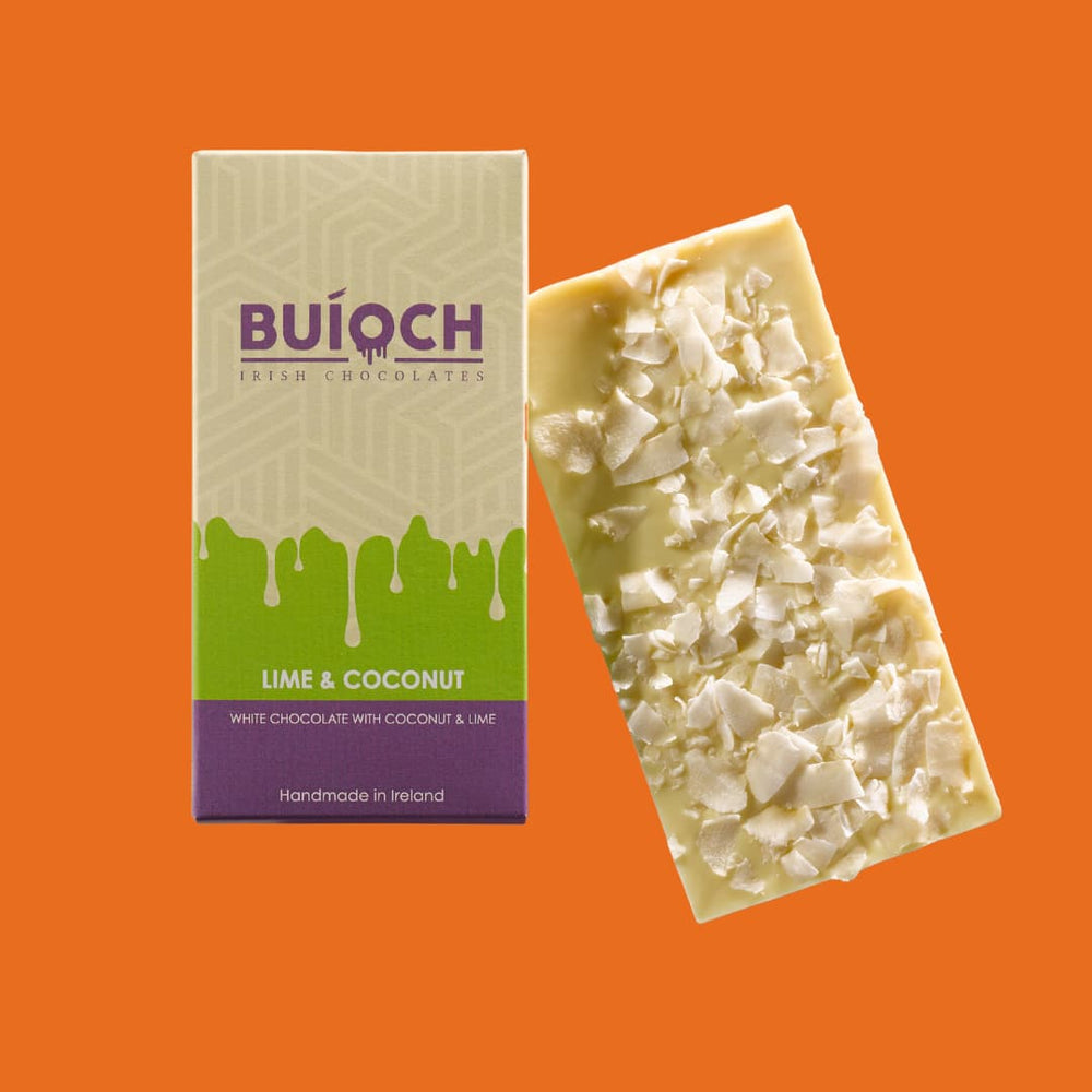 
                  
                    Lime and Coconut Bar - White chocolate with coconut and lime. Handmade by Buíoch Irish Chocolates. Packaging and bar on an orange background.
                  
                