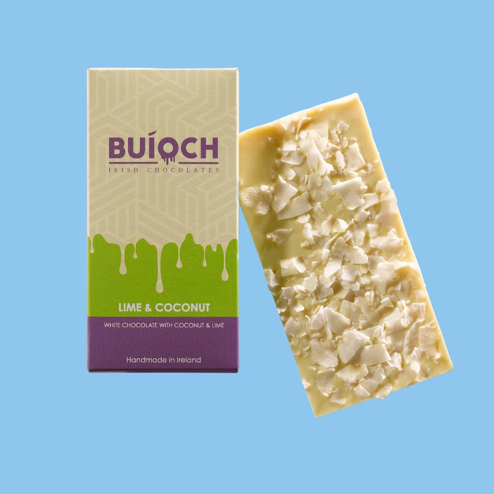 Lime and Coconut Bar - White chocolate with coconut and lime. Handmade by Buíoch Irish Chocolates. Packaging and bar on a blue background.