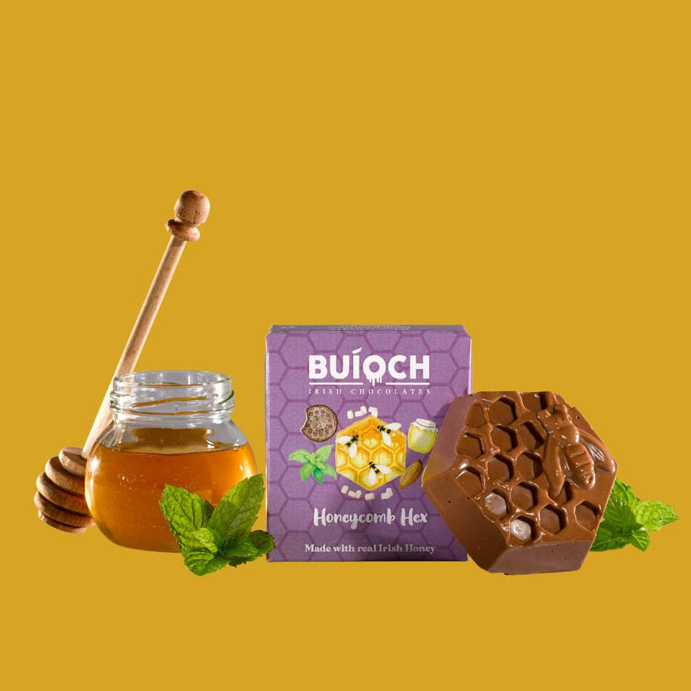 
                  
                    Milk Chocolate Mint Honeycomb Hex - Chocolate Hex, ingredients and packaging on a gold background. Handmade by Buíoch Irish Chocolates.
                  
                