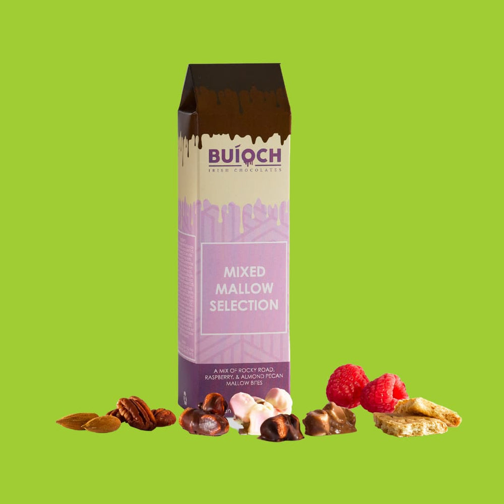 
                  
                    Mixed mallow selection. Milk chocolate rocky road mallow bites, white chocolate almond and pecan mallow bites and dark chocolate raspberry mallow bites. Handamde by Buíoch Irish Chocolates. Packaging, bites and ingredients on a lime green background
                  
                