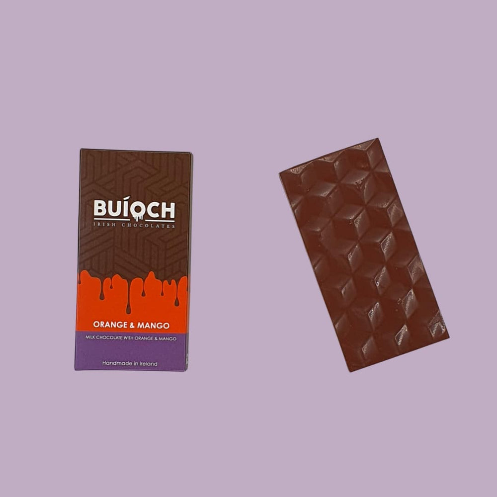 
                  
                    Orange and Mango Bar - Milk chocolate with oreange and mango. Handmade by Buíoch Irish Chocolates. Packaging and bar on a pink background.
                  
                