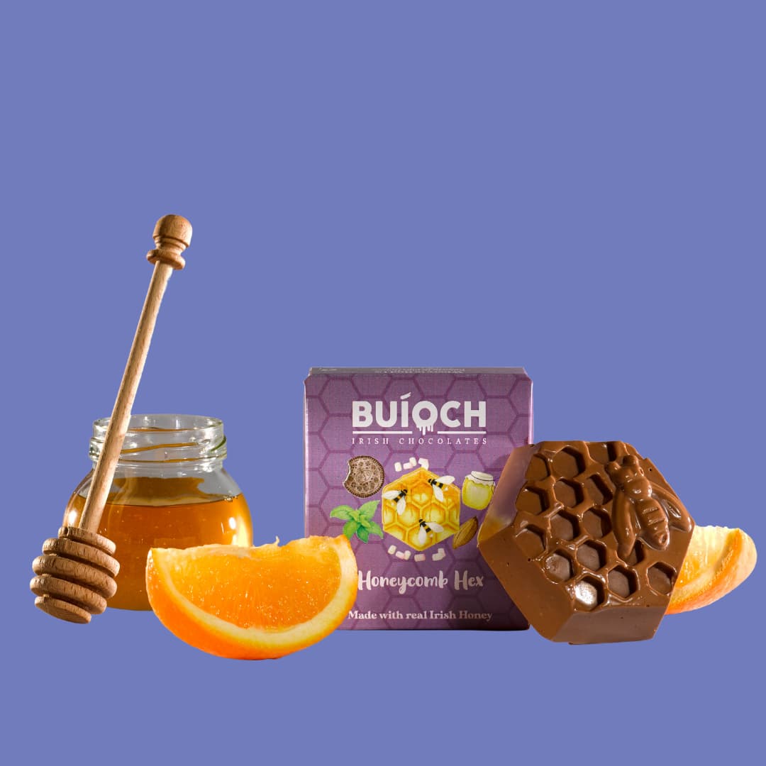 Milk Chocolate Orange Honeycomb Hex - Chocolate Hex, ingredients and packaging on a blue background. Handmade by Buíoch Irish Chocolates.