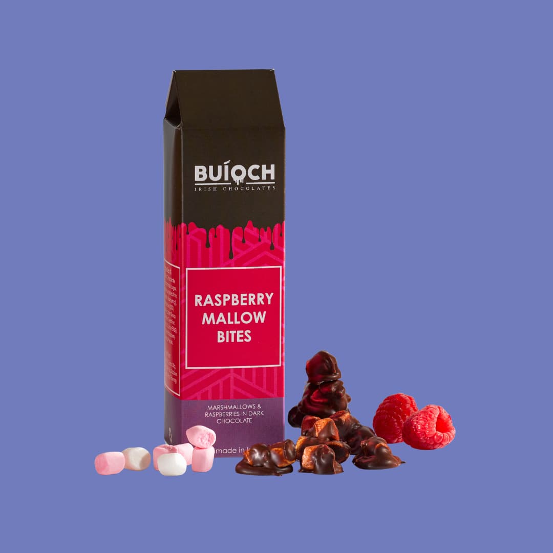 
                  
                    Raspberry Mallow Bites - Marshmallow and Raspberries in Dark Chocolate. Handmade by Buíoch Irish Chocolates. Packaging, Bites and Ingredients on a Blue Background.
                  
                