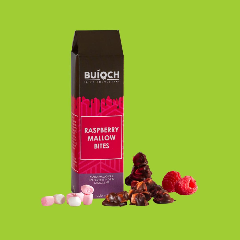 Raspberry Mallow Bites - Marshmallow and Raspberries in Dark Chocolate. Handmade by Buíoch Irish Chocolates. Packaging, Bites and Ingredients on a Lime Green Background.